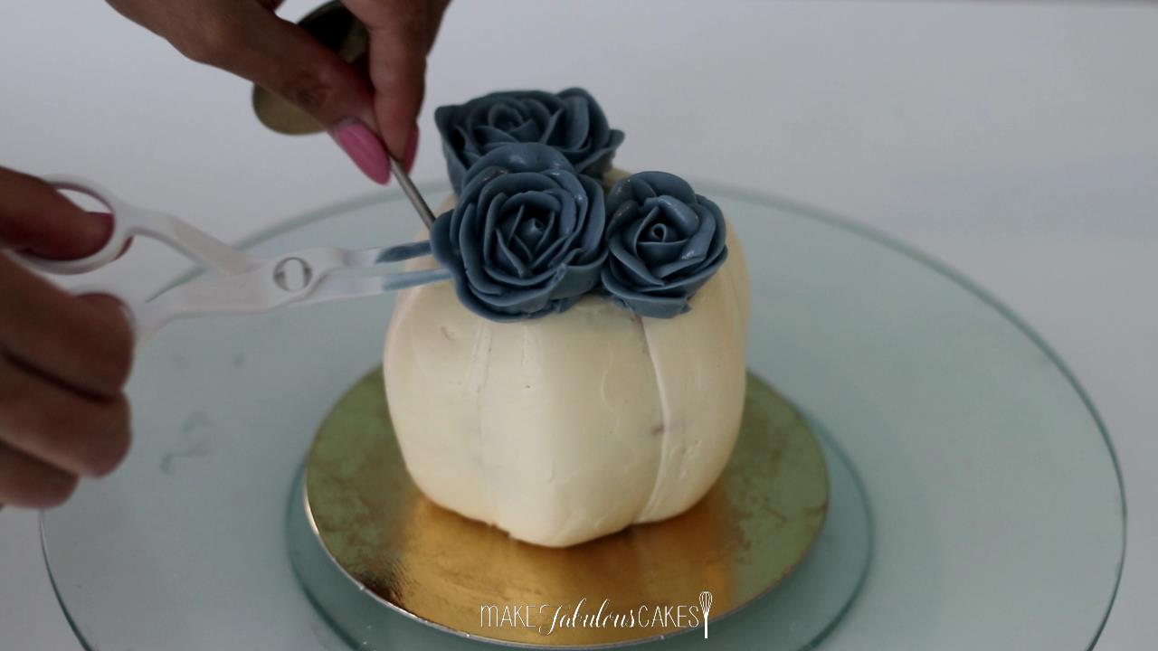 mini pumpkin cake with buttercream flowers