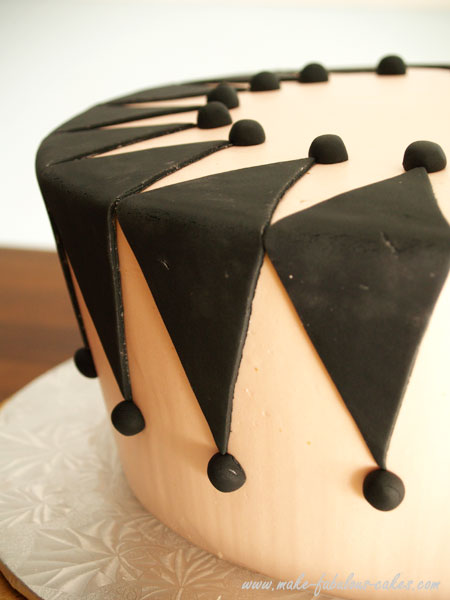design on side of masquerade cake