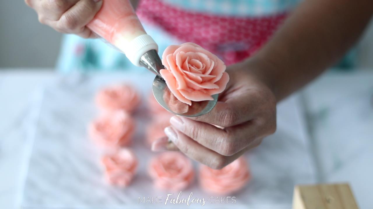 piping peach buttercream rose