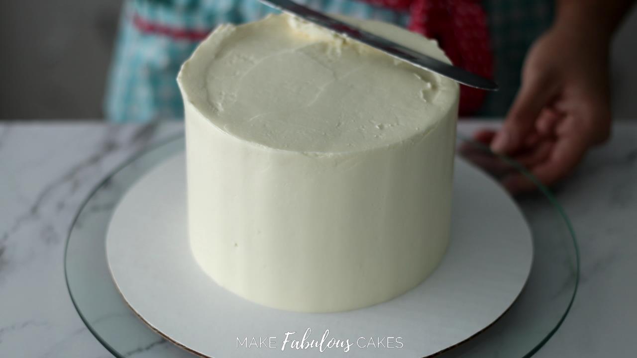 smoothing the frosting