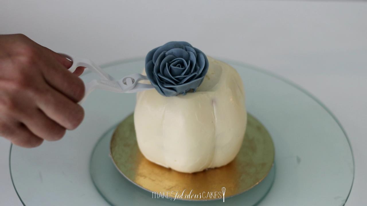 mini pumpkin cake with buttercream flowers