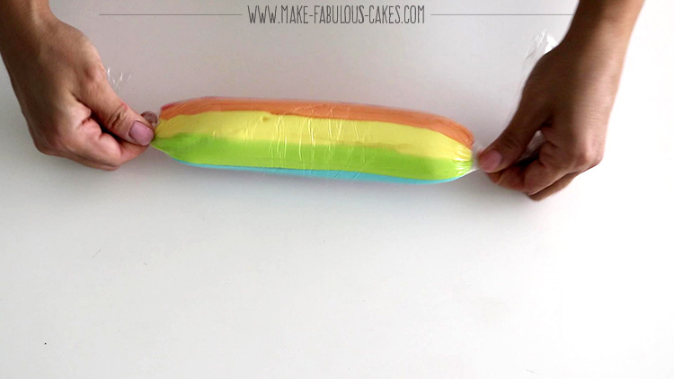 twisting the ends of the rainbow frosting icing plug