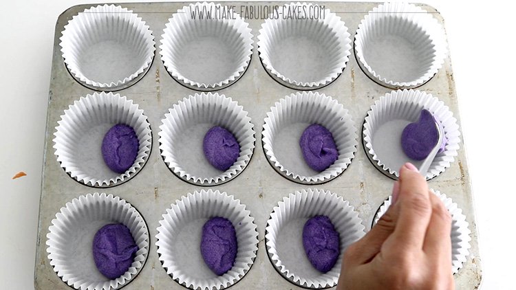 adding rainbow colored batter one tablespoon at a time