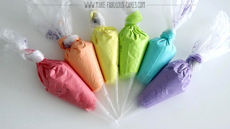 rainbow frosting in pastry bag